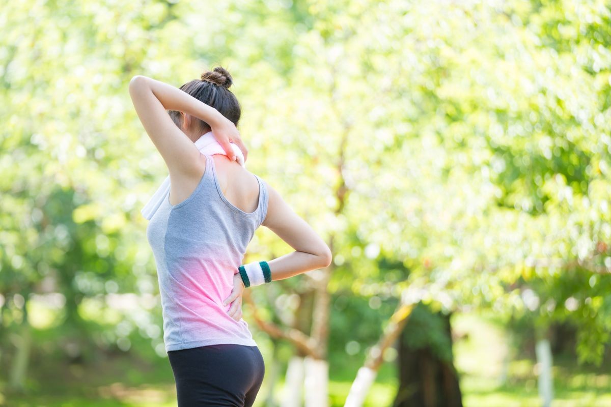 Running sport injury . Female athlete runner touching foot in pain due.